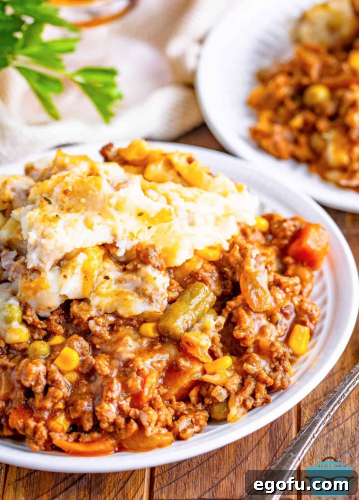 Comforting Slow Cooker Shepherd's Pie 9 A plate with a massive serving of Shepherd's Pie.