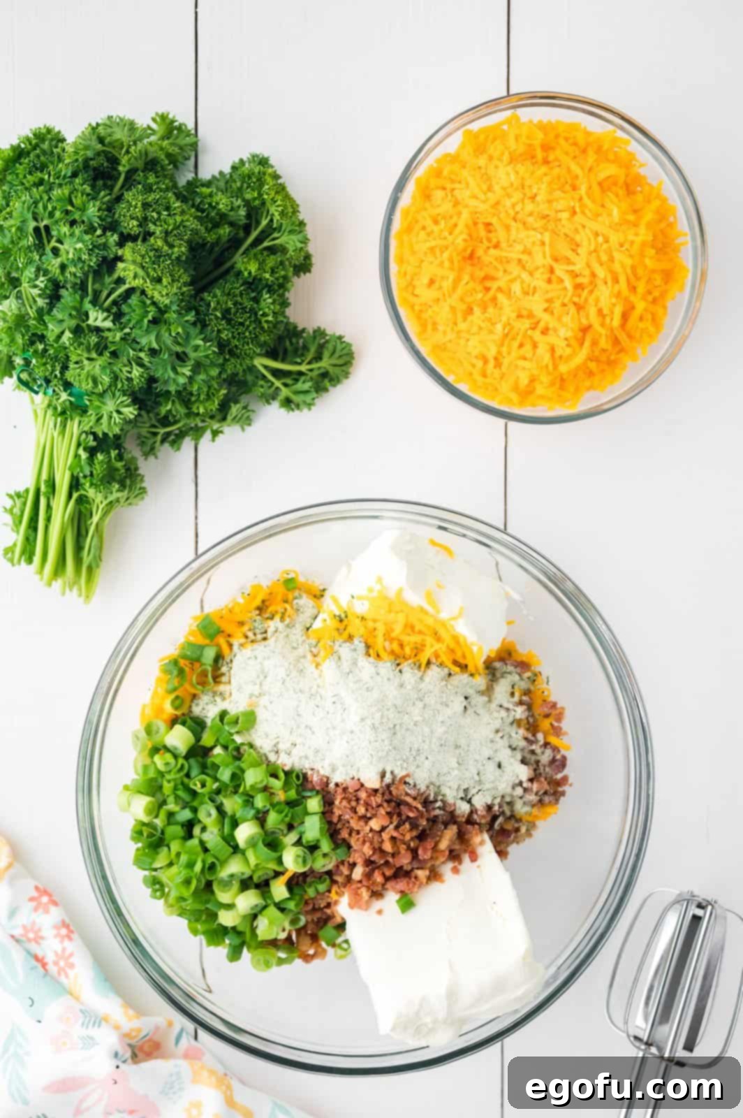 Bunny's Garden Cheeseball 5 All the delicious ingredients for a festive cheeseball mixed together in a large bowl, ready for molding.