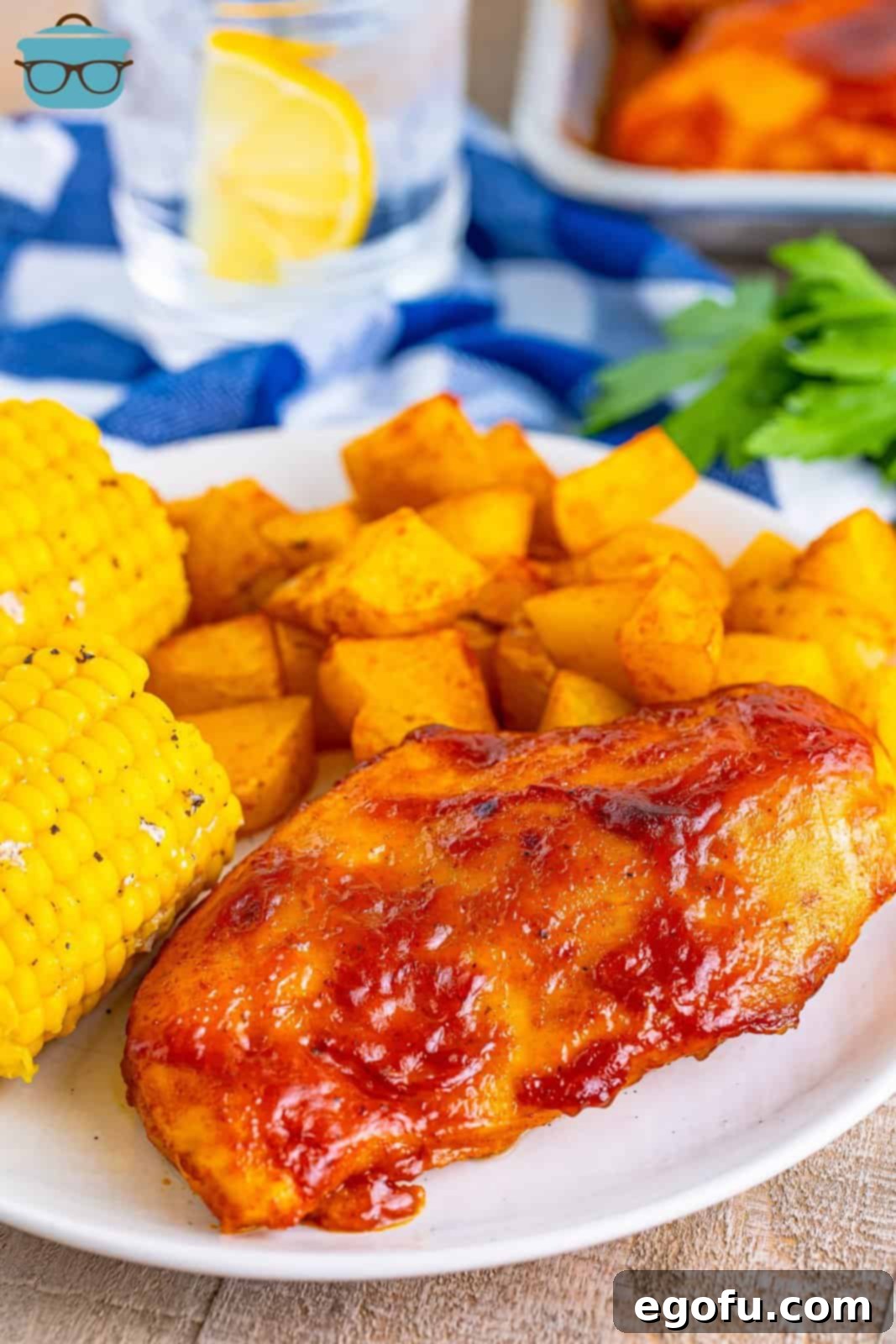 One-Pan BBQ Chicken Dinner 2 A close look at the plate of BBQ chicken, roasted potatoes, and sweet corn.