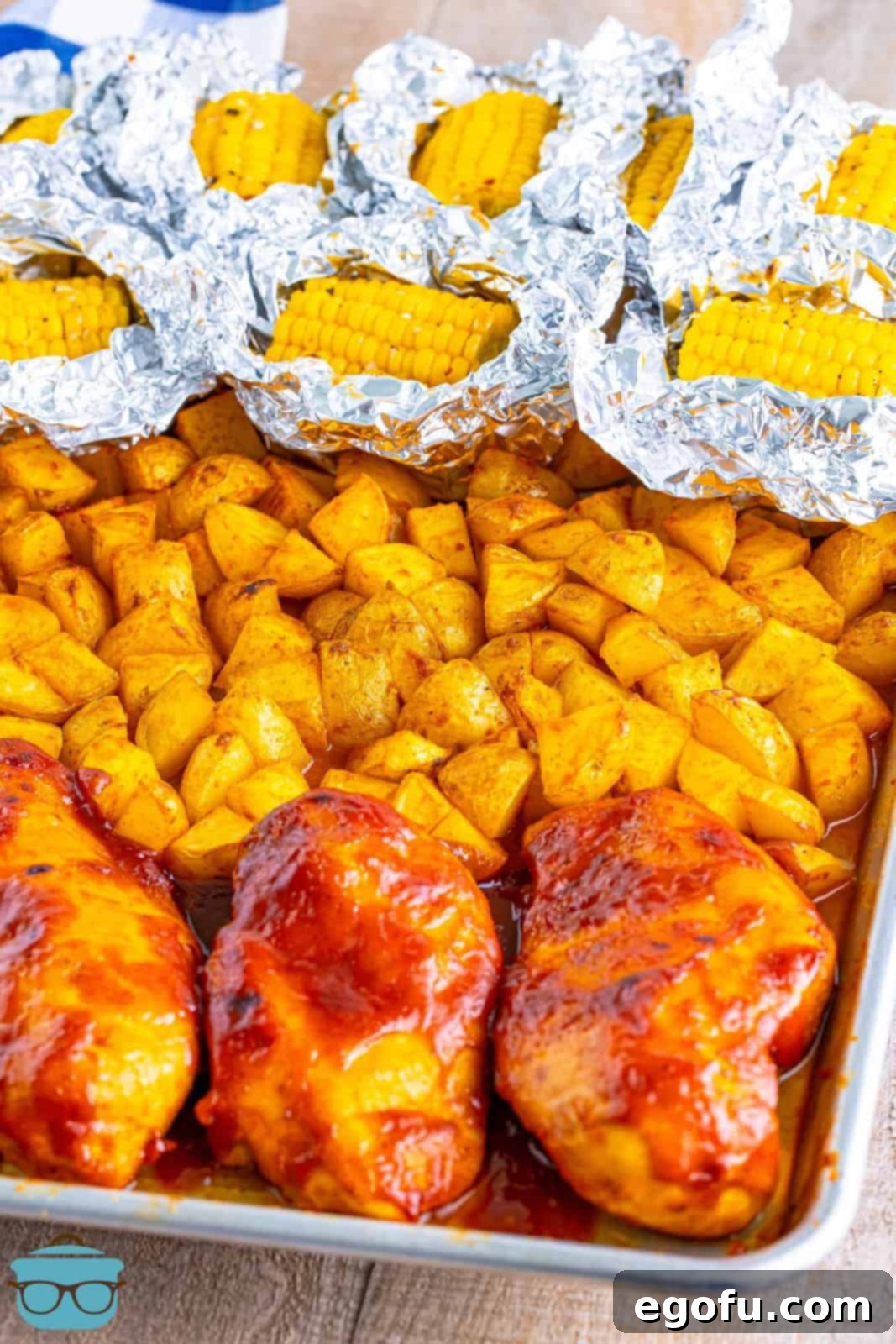 One-Pan BBQ Chicken Dinner 10 A fully cooked BBQ Chicken Sheet Pan Meal with glazed chicken, tender potatoes, and perfectly roasted corn on the cob.
