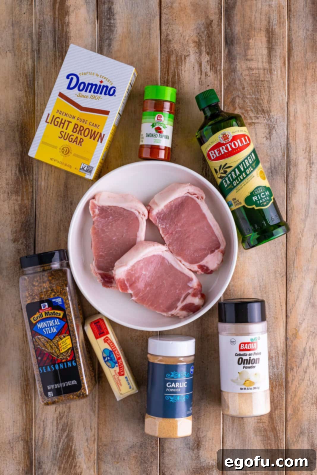 Crispy Air Fried Pork Bites 4 Pork Chops, olive oil, Montreal steak seasoning, light brown sugar, smoked paprika, onion powder, garlic powder, and salted butter.