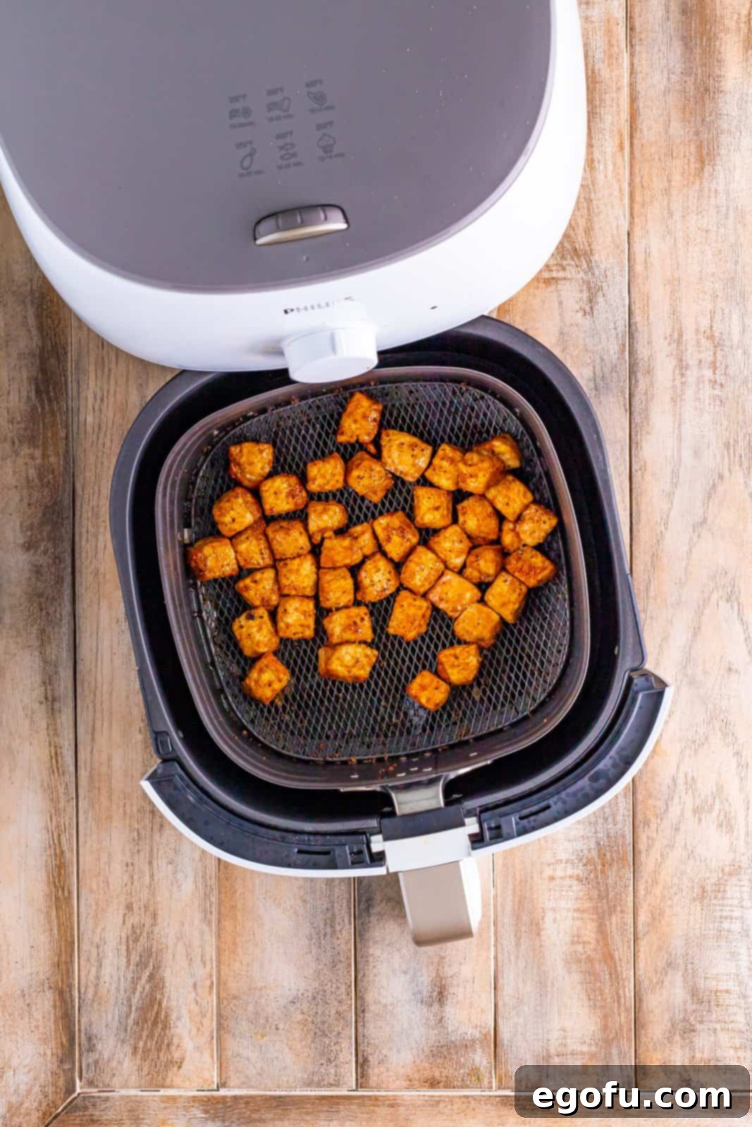 Crispy Air Fried Pork Bites 7 Cooked air fryer pork chop bites sitting in the air fryer basket.