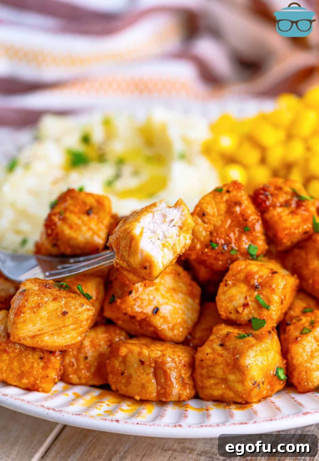 Crispy Air Fried Pork Bites 9 A half bitten Pork Chop Bite on a fork.