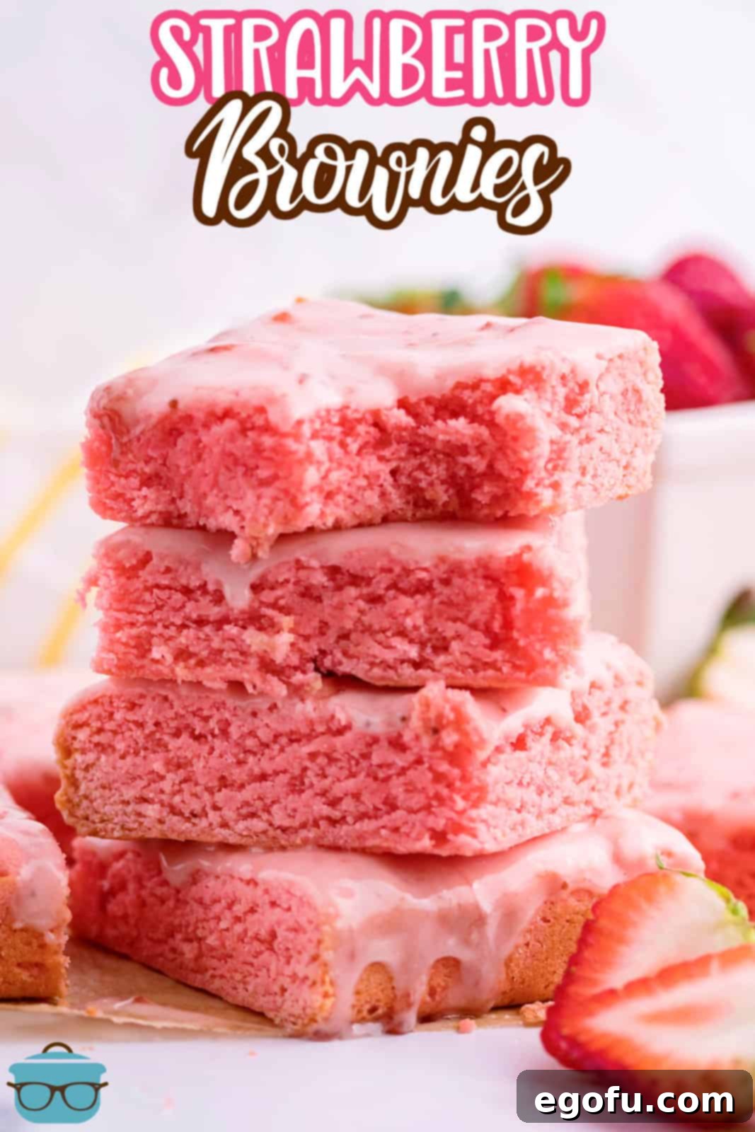 Strawberry Swirl Brownie Bliss 3 A close-up of four homemade strawberry brownies neatly stacked in a pile, showcasing their soft texture and vibrant pink color.