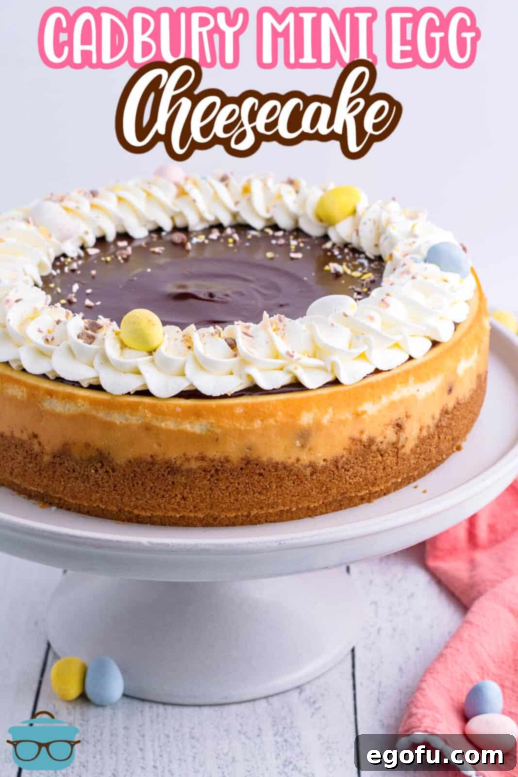 A whole Cadbury Mini Egg Cheesecake on a platter.