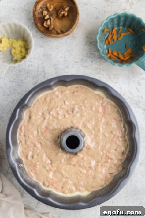Carrot cake batter in a bundt pan.