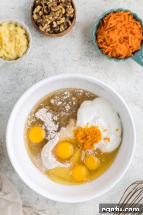 Cake mix, eggs, oil, sour cream, and orange zest in a large mixing bowl.