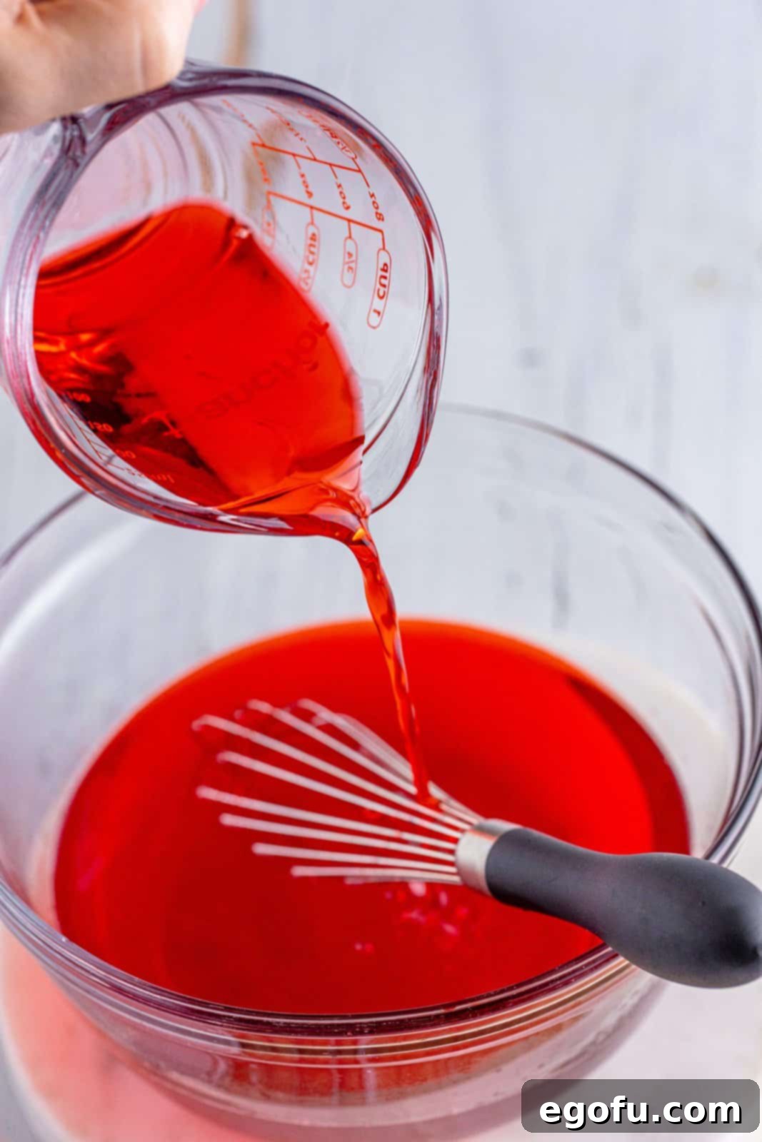 Agave Aurora Shots 5 Grenadine being poured in Cherry Jello, water, and Tequila.