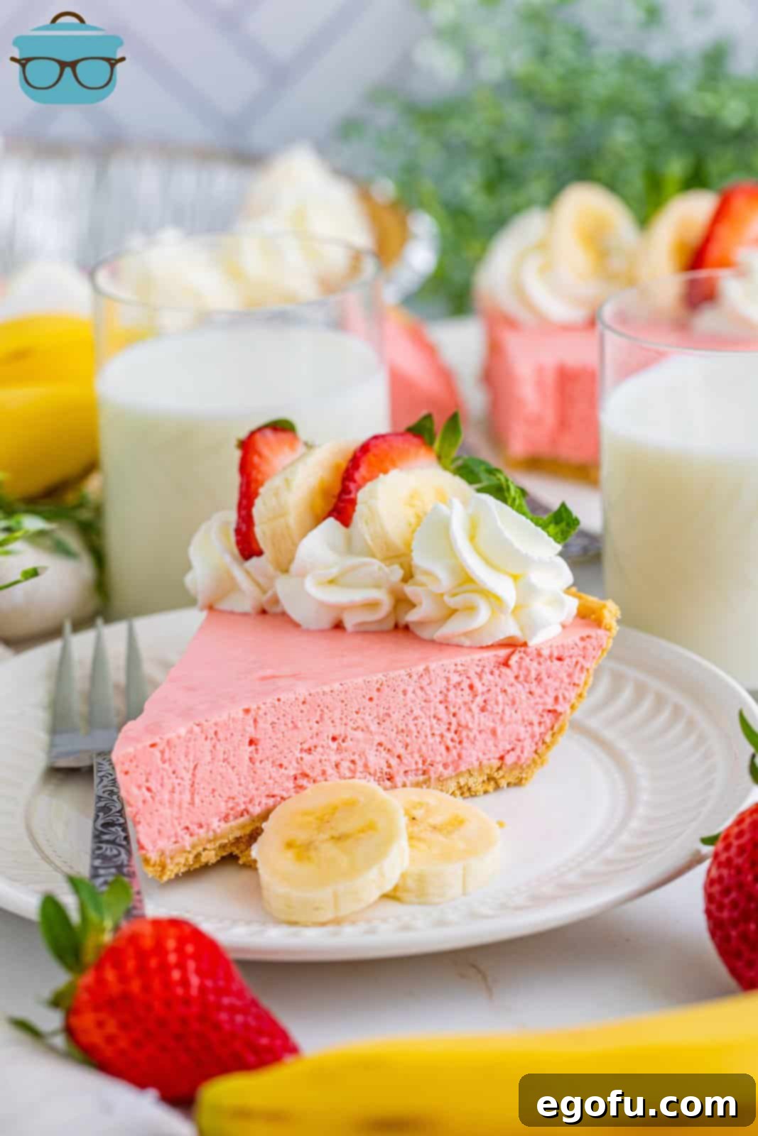 A piece of homemade Strawberry banana Jello Pie on a plate.