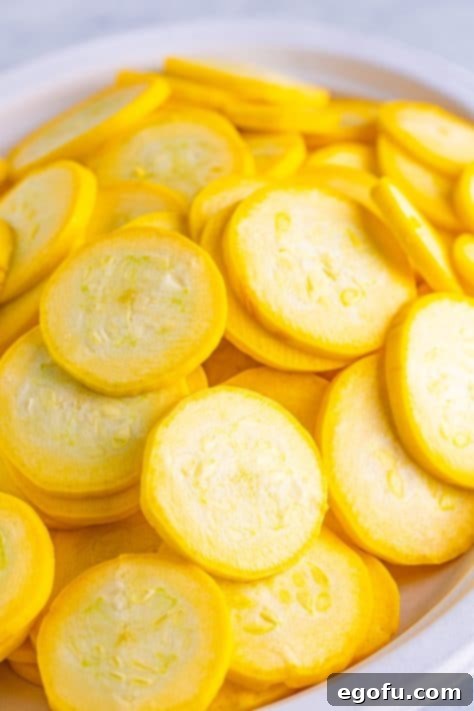 Down Home Fried Squash 11 A bowl of cut yellow squash.