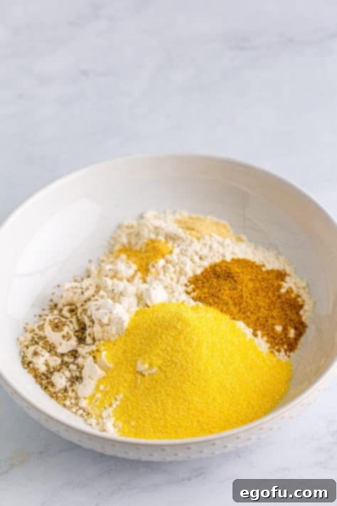 Down Home Fried Squash 12 A bowl with dry breading ingredients.