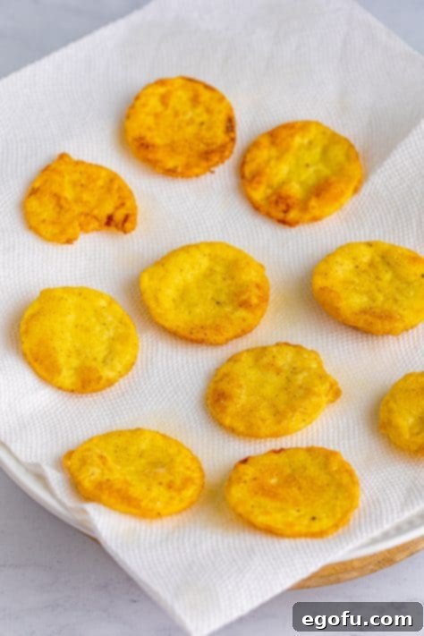 Down Home Fried Squash 17 Fresh fried squash on a paper towel.