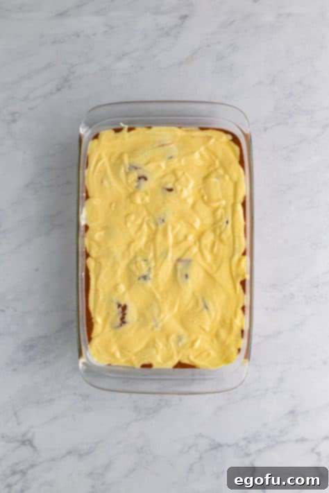 Amore Italian Dream Cake 12 A chocolate cake with the ricotta layer on top.