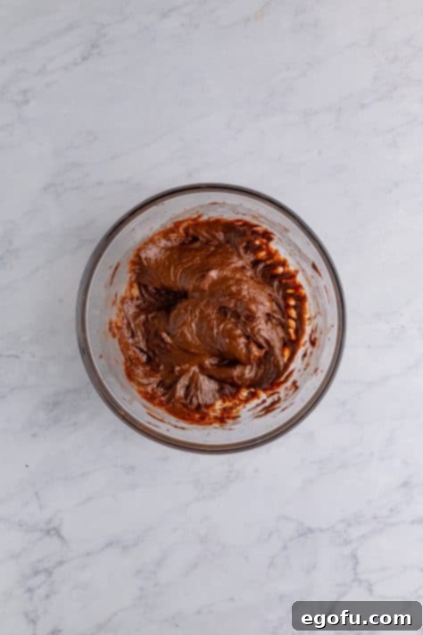 Amore Italian Dream Cake 14 Chocolate pudding in a mixing bowl.