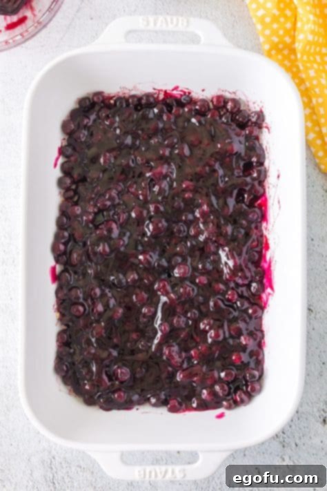 blueberry pie filling added to baking dish