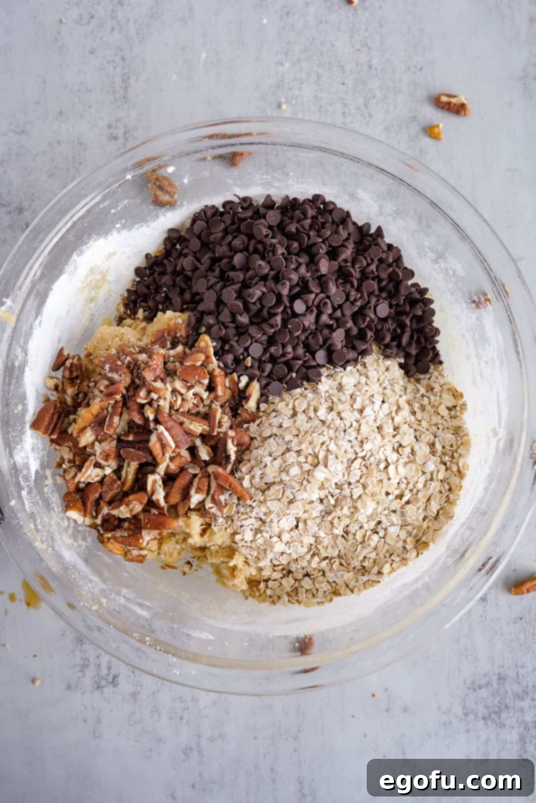 Oatmeal Chocolate Chip Delights 8 Folding quick oats, semi-sweet mini chocolate chips, and chopped pecans into oatmeal cookie dough for a delicious texture.