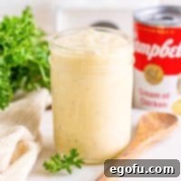 A jar of homemade condensed cream of chicken soup, ready for use or storage.
