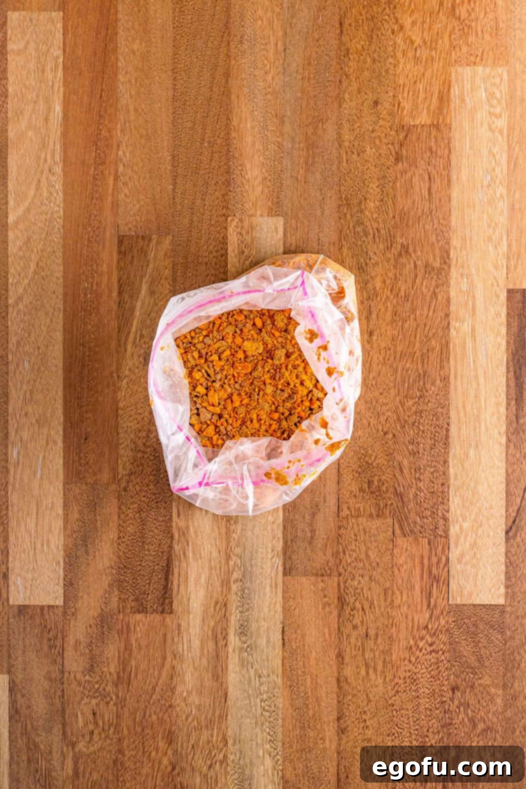 Golden Butterfinger Dream 7 A clear plastic bag containing crushed Butterfinger candy bars, showing the broken pieces.