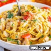 Close up of a bowl of garlic chicken pasta.