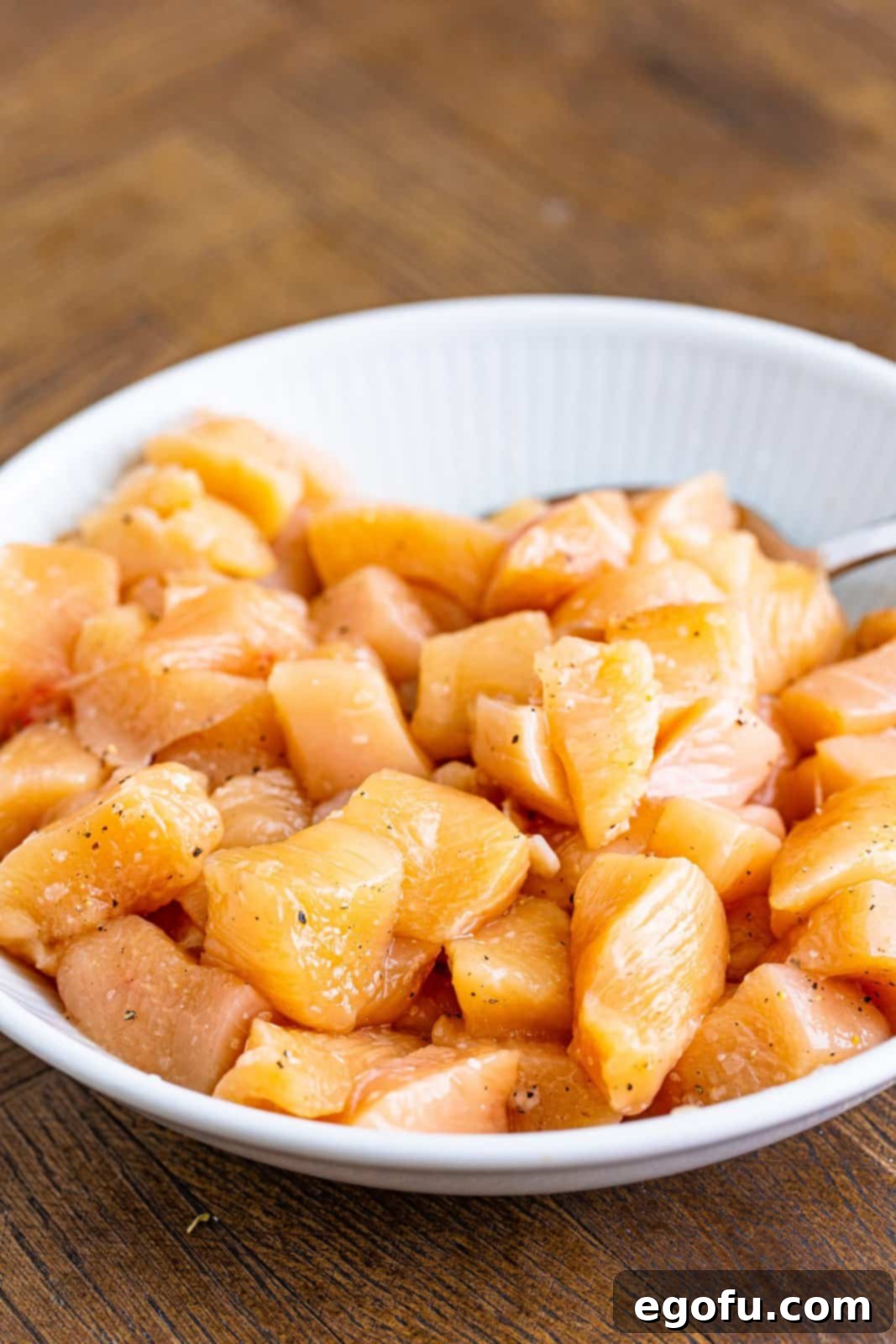 Diced chicken with salt and pepper. 