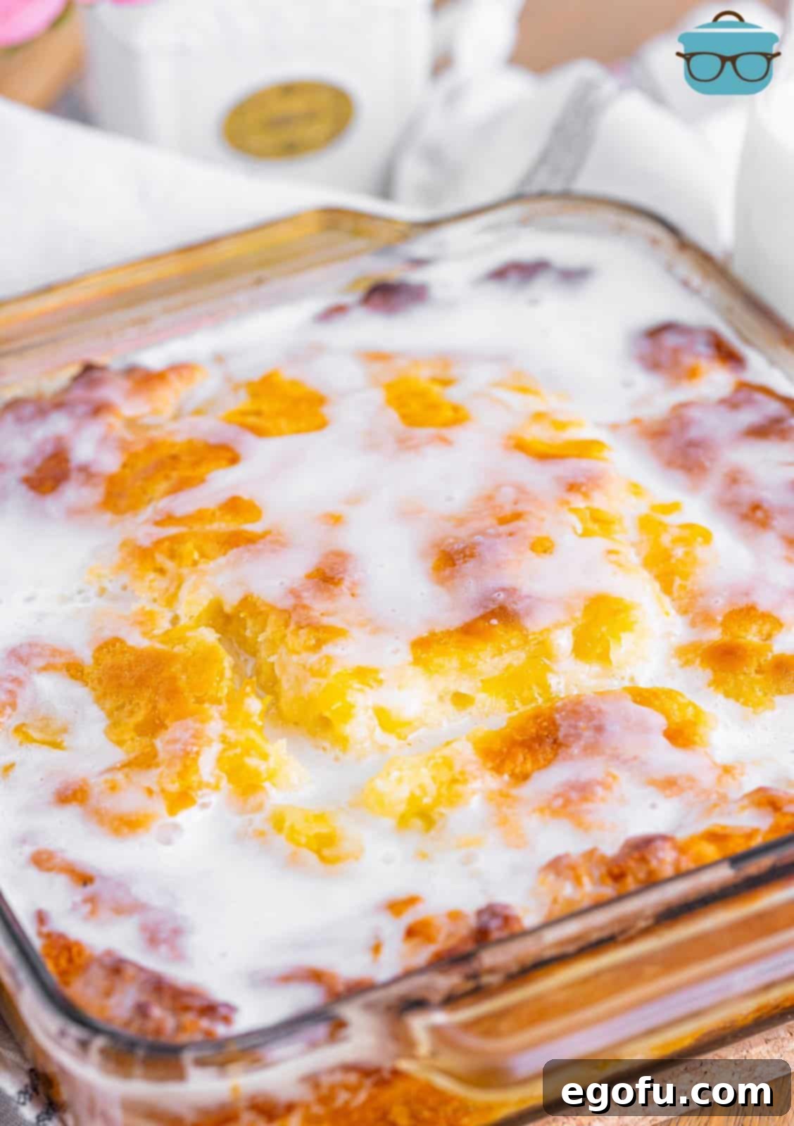 Sun-Kissed Peach Butter Swim Biscuits 13 A full baking dish of Peach Butter Swim Biscuits, beautifully iced and ready to be served.