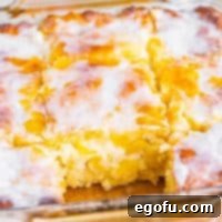 Sun-Kissed Peach Butter Swim Biscuits 15 Close up looking at a few Peach Butter Swim Biscuits in a dish.