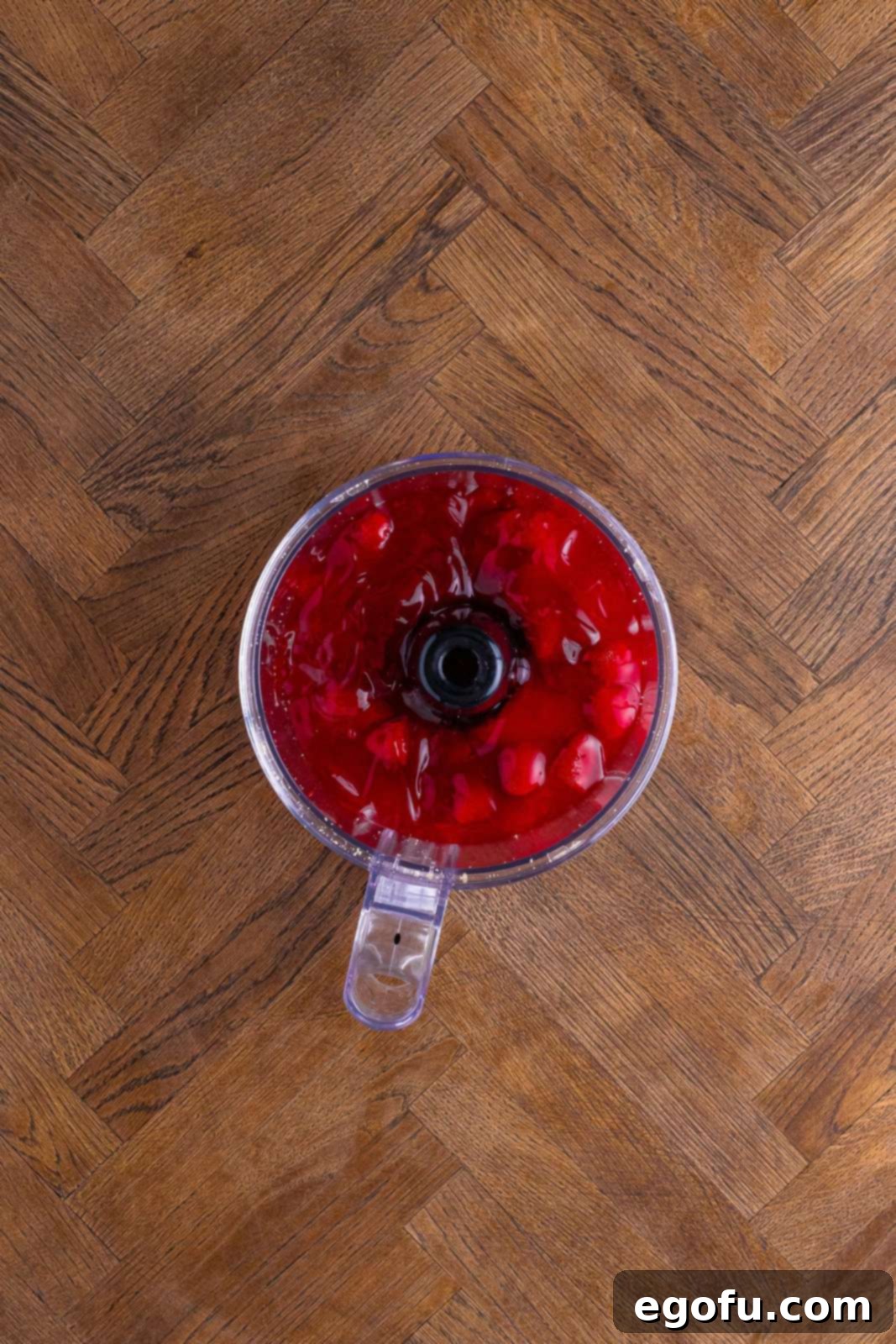 Layered Strawberry Bliss 8 Strawberry pie filling being processed until smooth in a food processor.