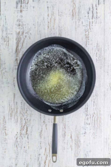 Butter melted in a skillet.