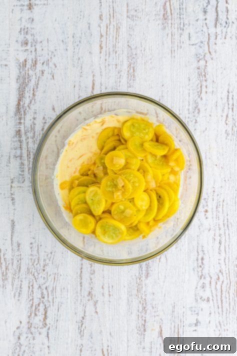 Drained squash and eggs, sour cream, mayonnaise, and cheese mixed together.