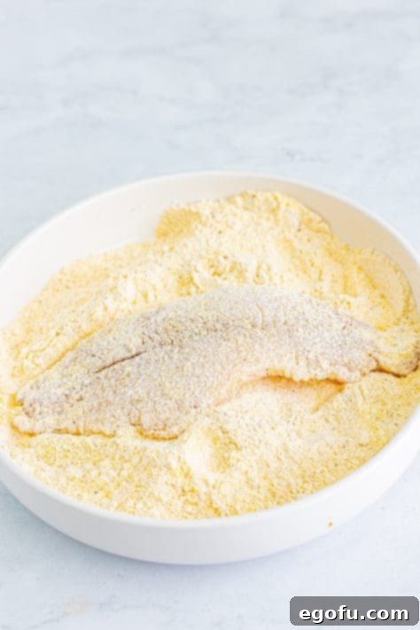 Golden Crispy Catfish 16 A fish fillet in the seasoning mixture.