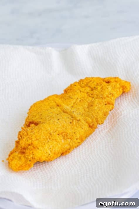 Golden Crispy Catfish 20 fried catfish on paper towels.