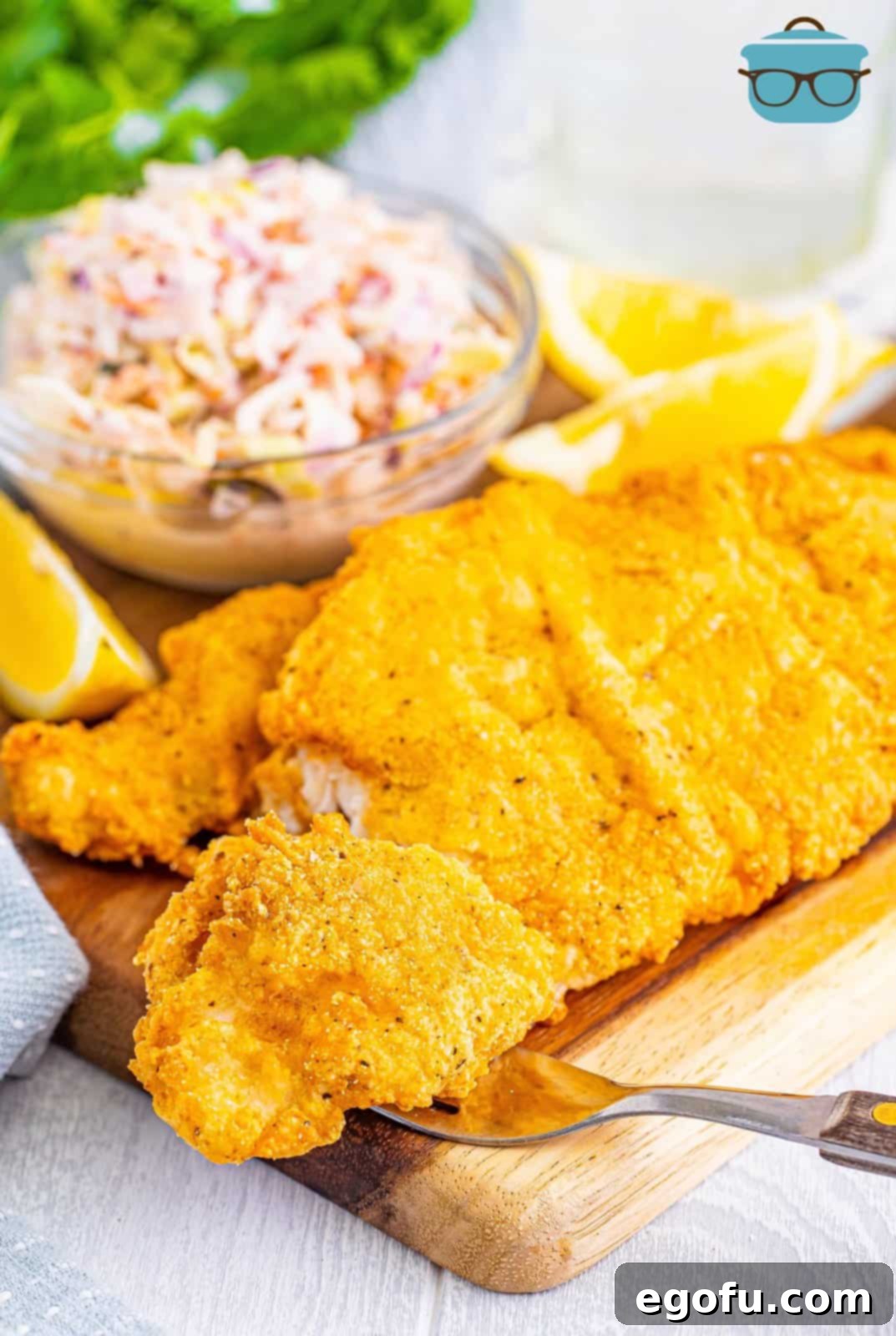 Golden Crispy Catfish 10 A few pieces of perfectly fried catfish on a serving platter, ready to be enjoyed.