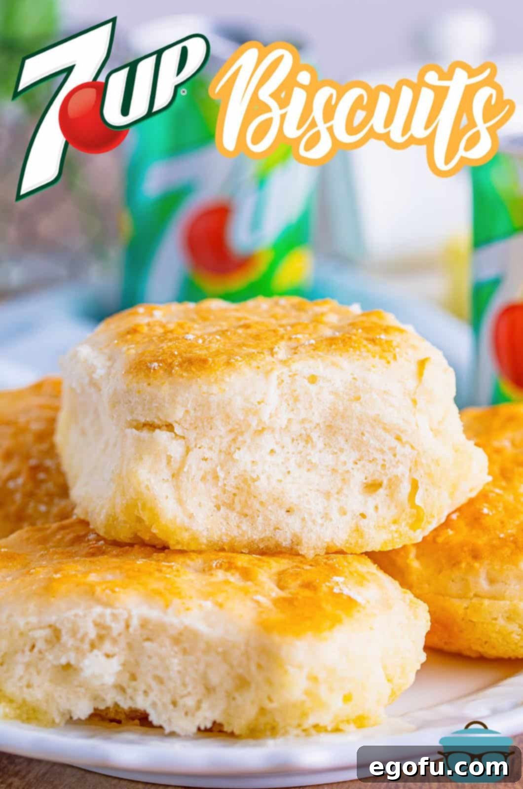 Two golden brown 7Up biscuits stacked on top of each other, showcasing their fluffy texture.