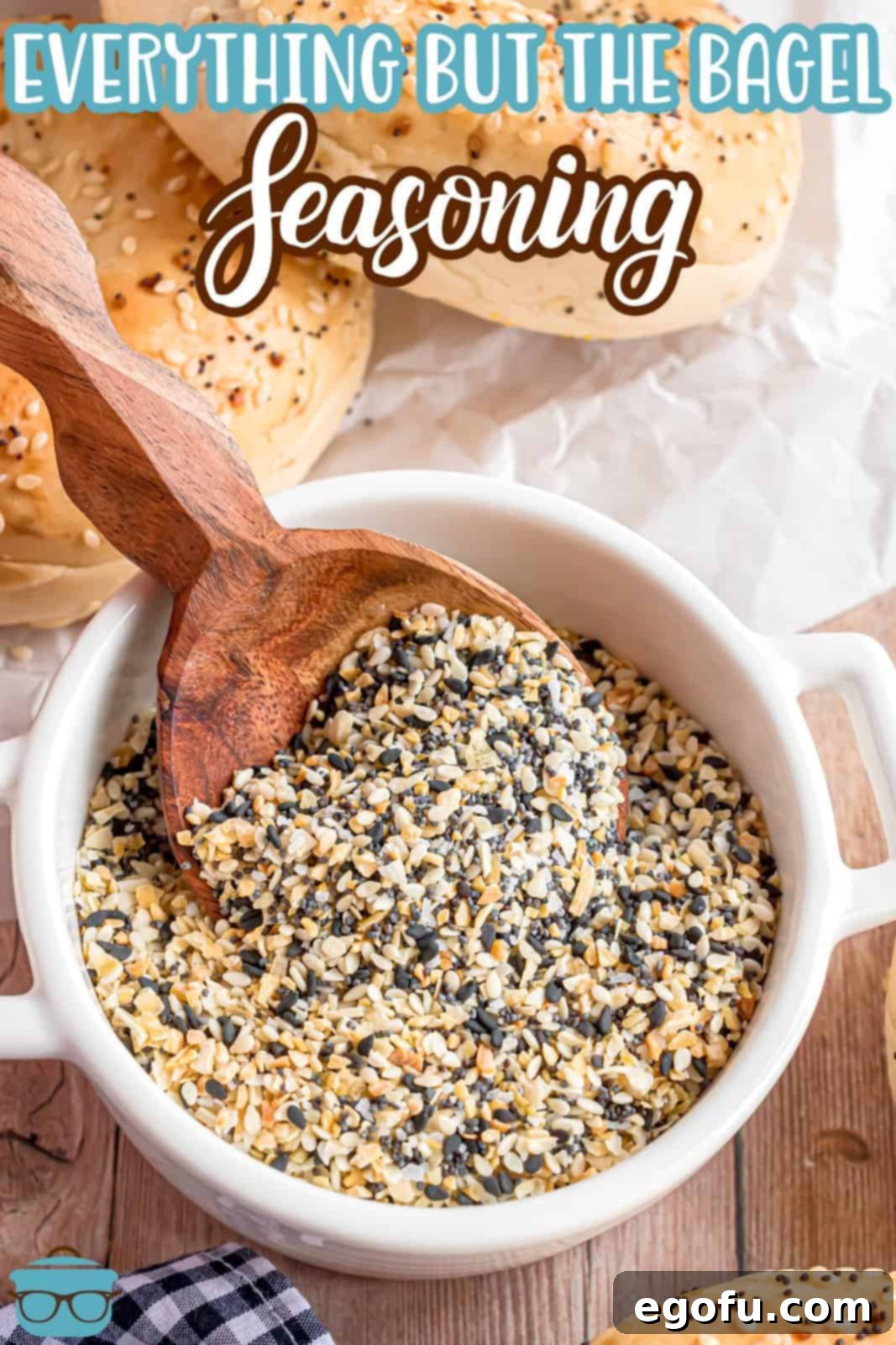 A spoon in a container of homemade Everything But The Bagel Seasoning.