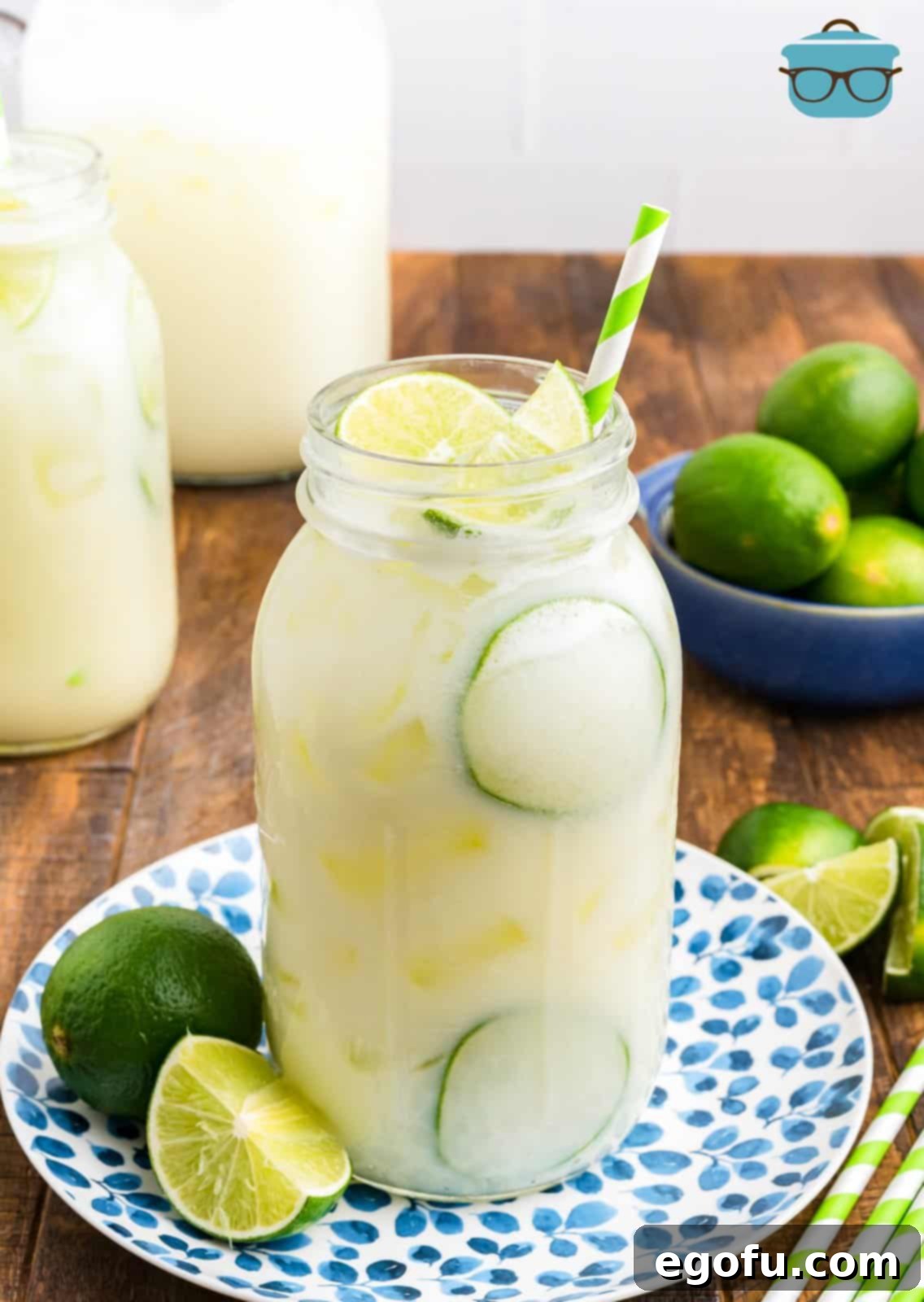 Brazilian Lemon Dream 2 A jar of Brazilian Lemonade with fresh limes, garnished and ready to serve.