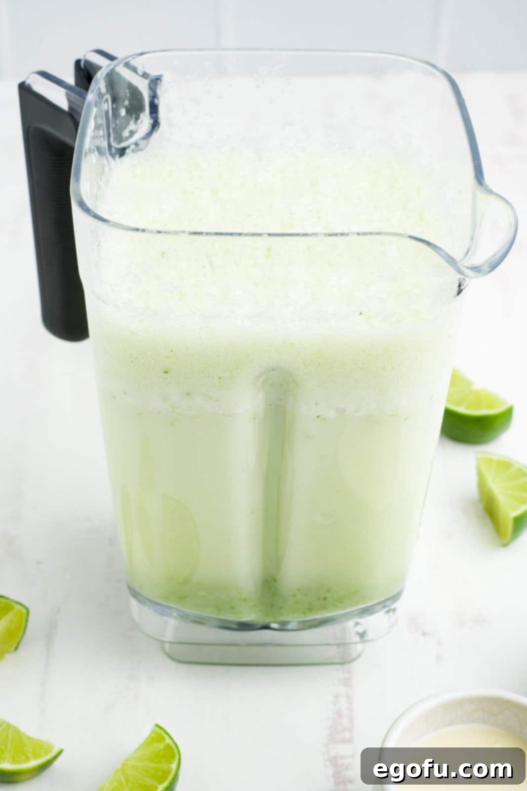 Brazilian Lemon Dream 8 A blender with the strained lime juice and sweetened condensed milk, ready for the final pulse.