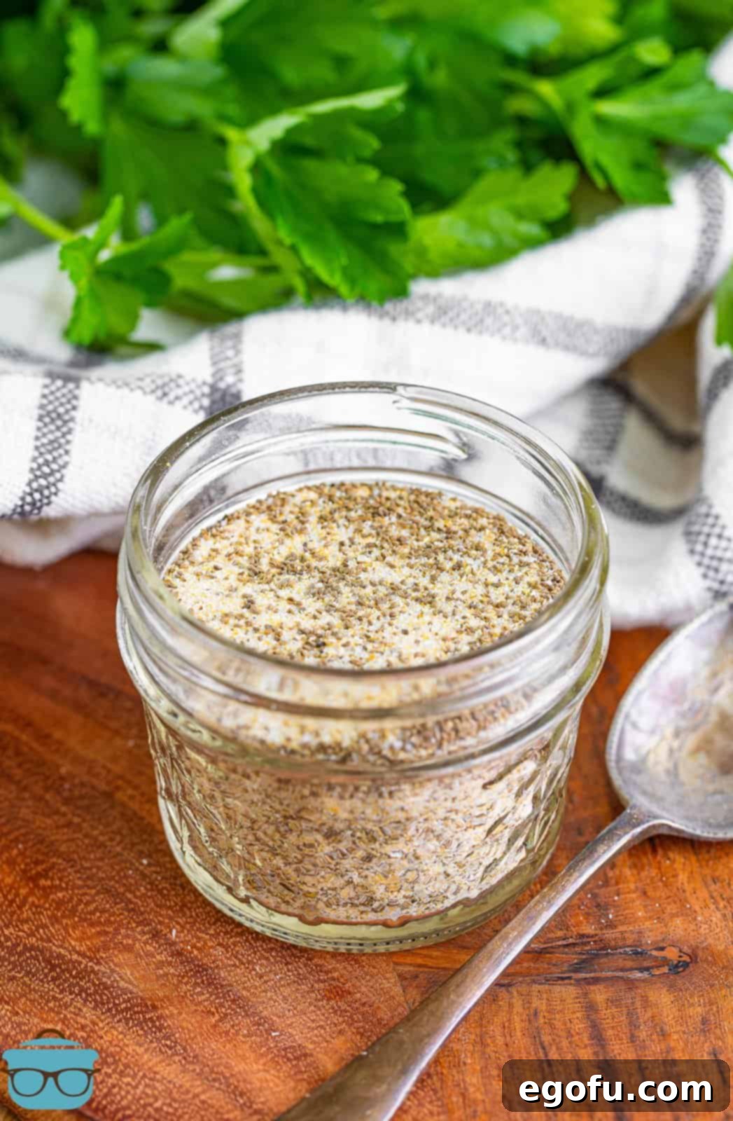 A small jar of homemade Beau Monde® Seasoning, ready for use.