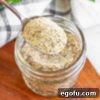 Closely looking at a spoon full of Beau Monde® Seasoning.