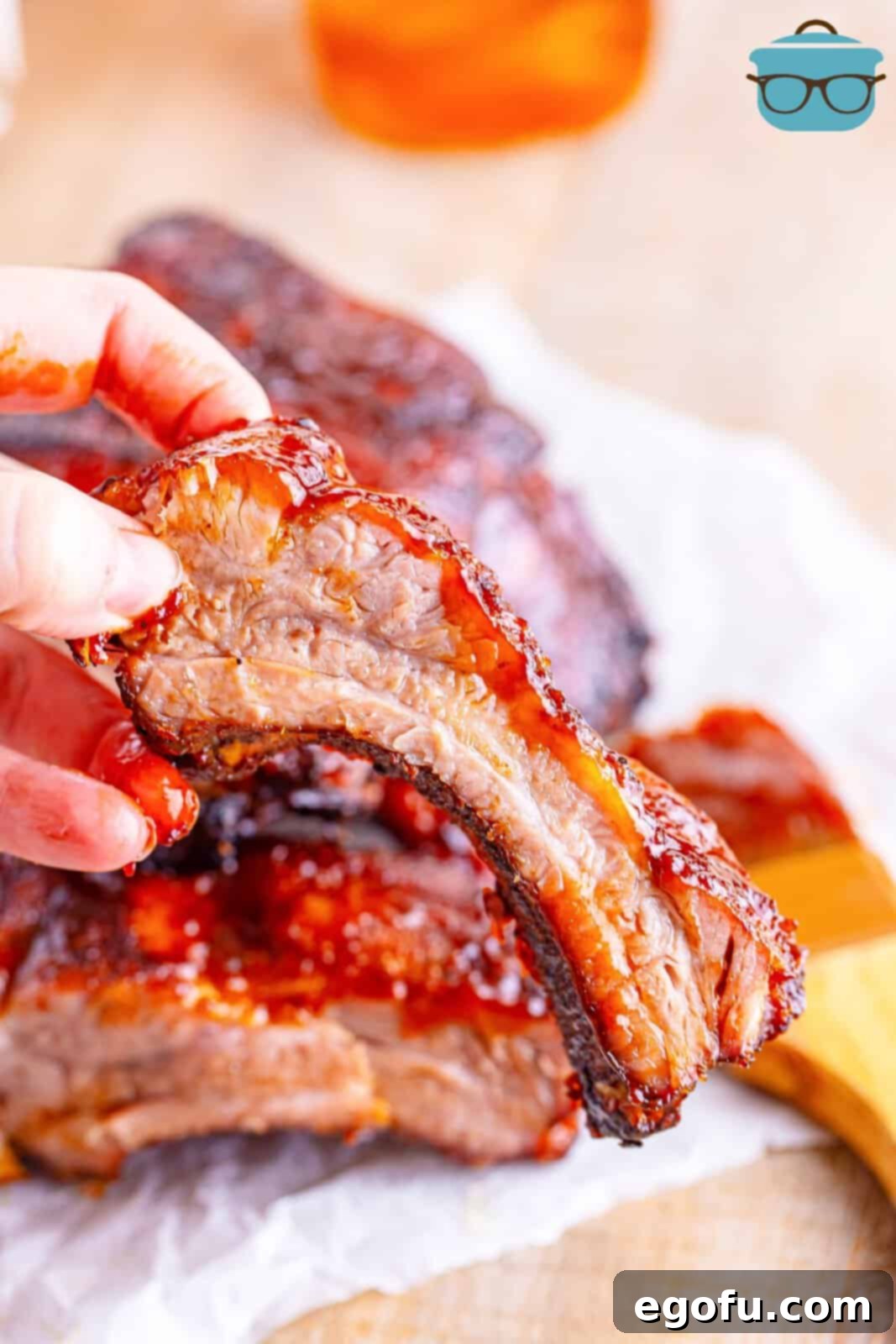 A hand holding a perfectly cooked Air Fryer Rib, ready to be enjoyed.