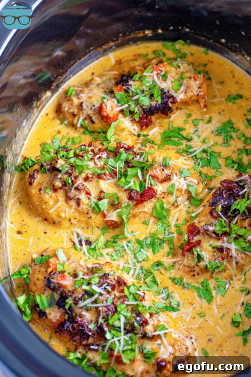 Slow Cooker Love Potion Chicken 7 Close up looking at Marry Me Chicken in a crock pot.