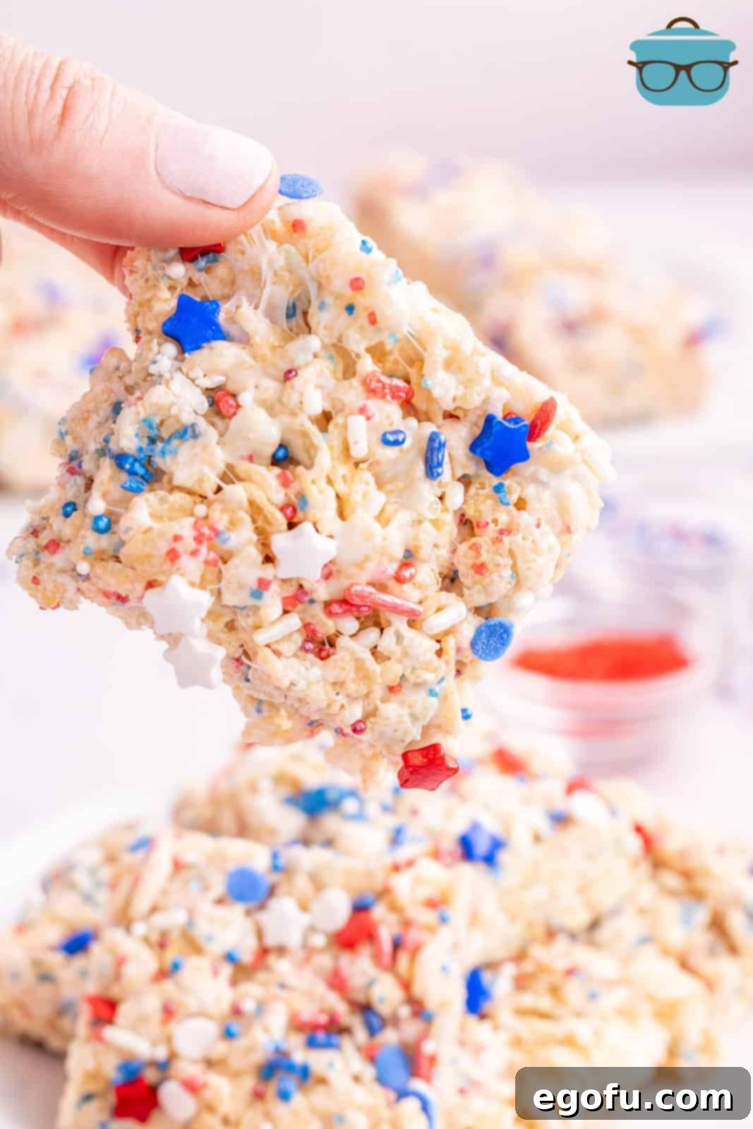 Star-Spangled Cereal Treats 2 A hand holding a 4th of July Rice Krispies.