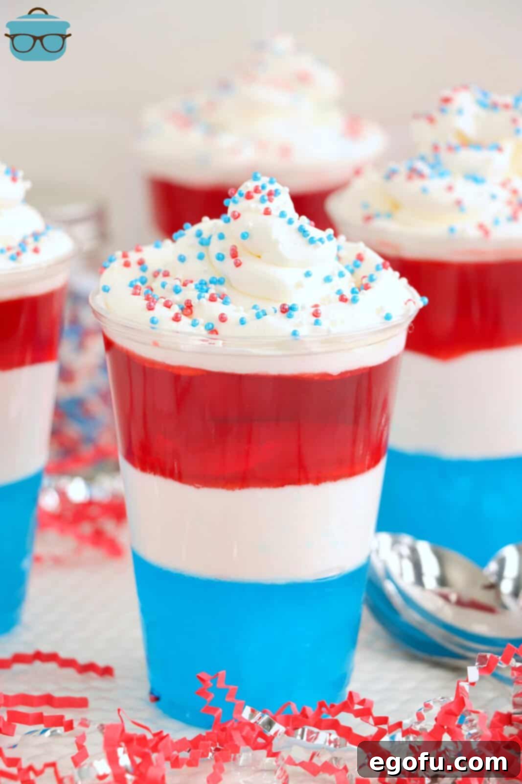 Festive Tri-Color Jell-O Cups 2 A couple red, white, and blue layered jello cups, perfectly arranged.