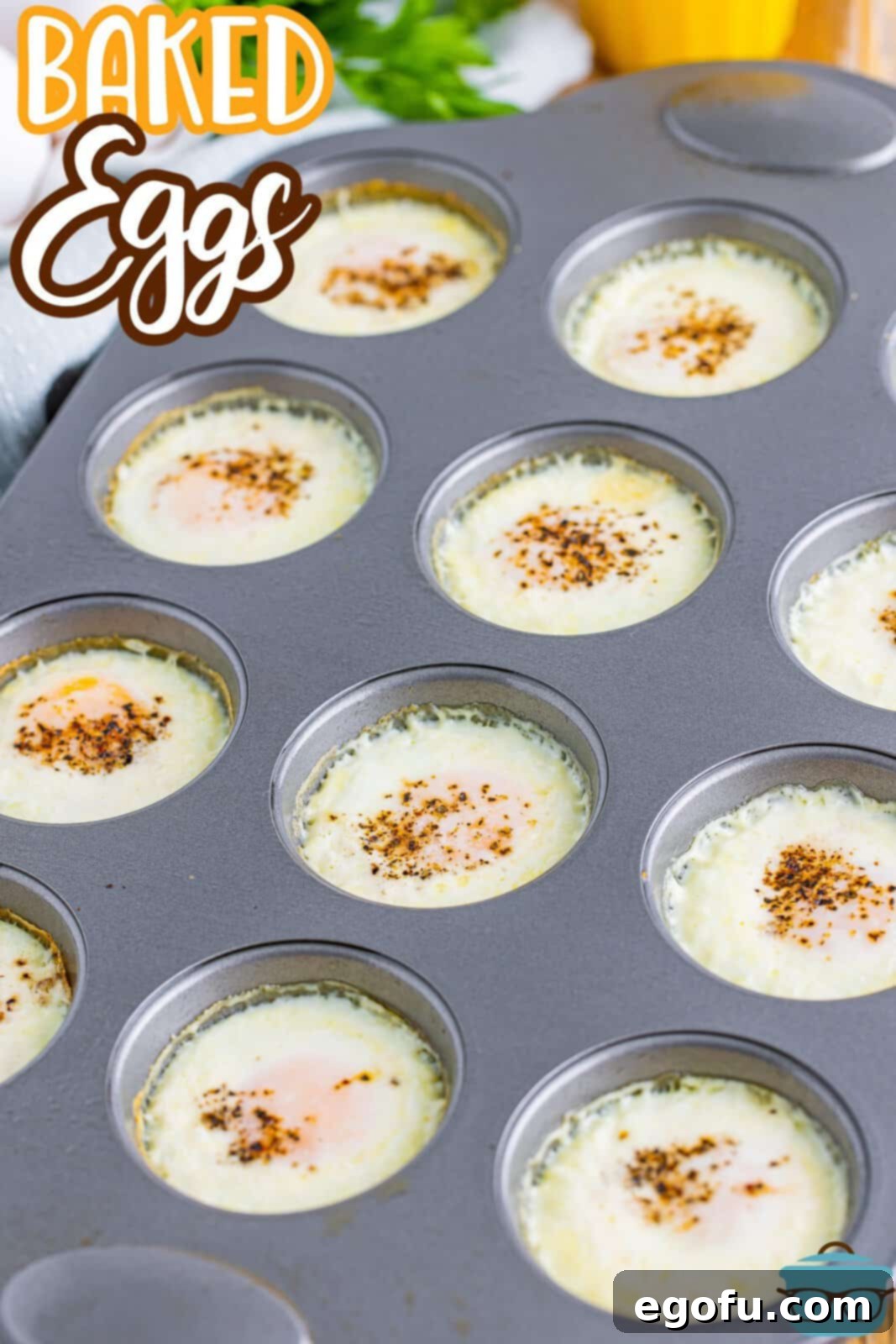 A muffin tin filled with unbaked eggs, each ready for its heavy cream and seasoning.