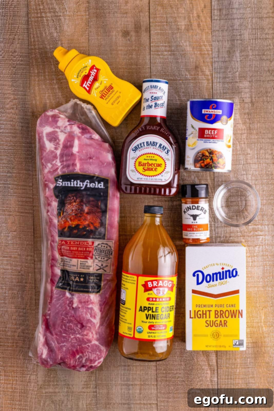 Baby back ribs, apple cider vinegar, light brown sugar, barbecue sauce, yellow mustard, beef broth, water, and barbecue seasoning.