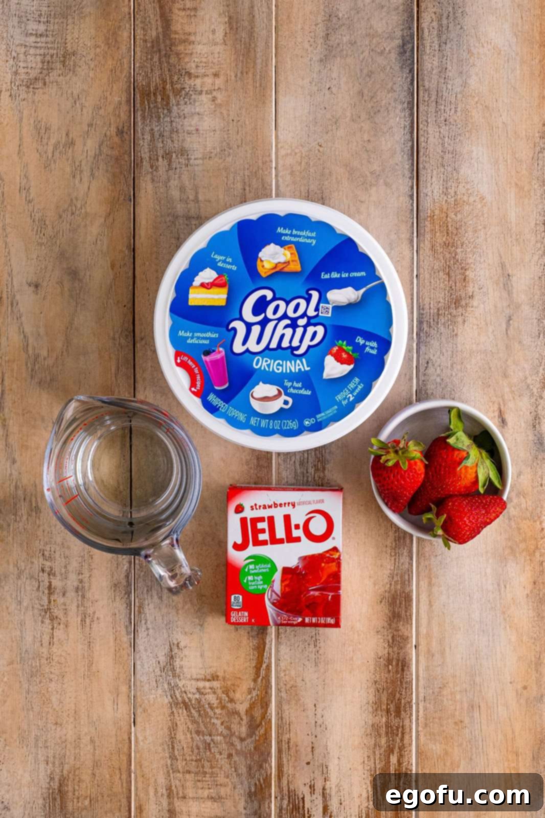It's above Cool Whip, fresh strawberries, strawberry Jell-O powder, and water.