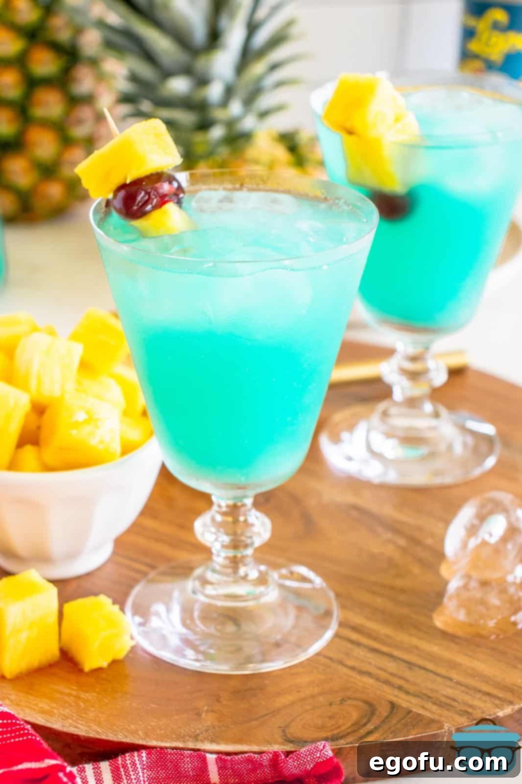 Closely looking at a blue drink, highlighting its vibrant color and frosty glass.