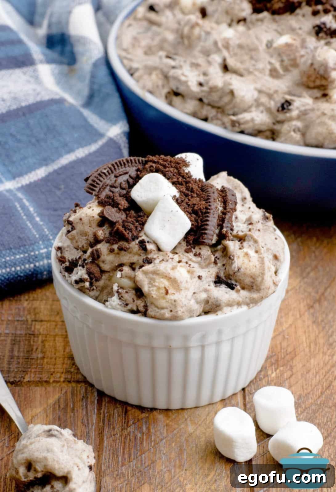 A small bowl of Oreo fluff with marshmallows and crushed Oreos on top, ready to be enjoyed.