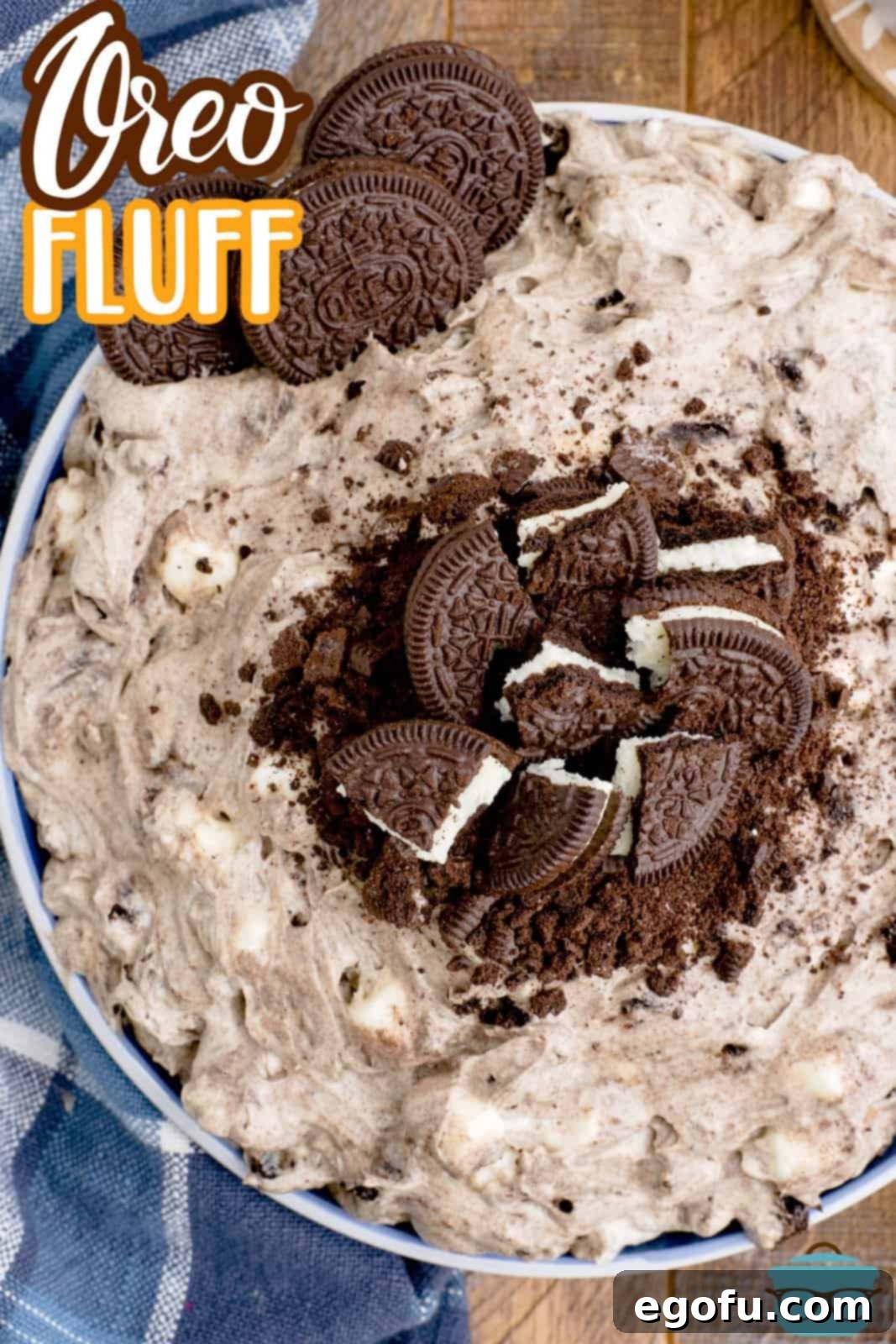 A large bowl of creamy Oreo fluff, generously topped with crushed Oreo cookies, ready to serve.