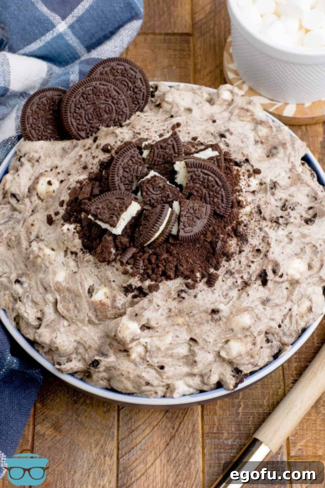 A stunning bowl of Oreo fluff, richly adorned with whole and crushed chocolate Oreo cookies, ready for enjoyment.