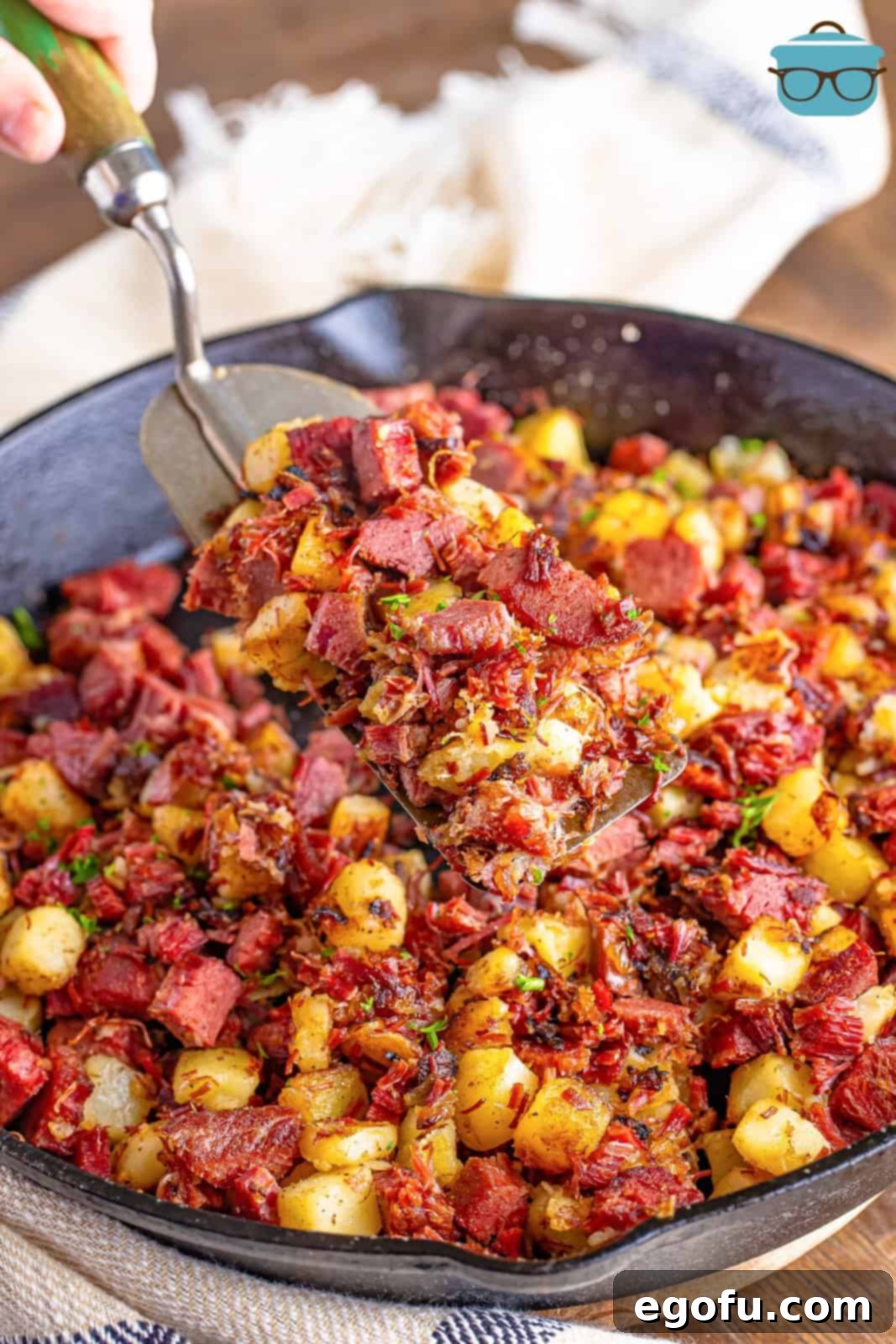 Homemade Corned Beef Hash 2 A serving utensil in a dish of Corned Beef Hash.
